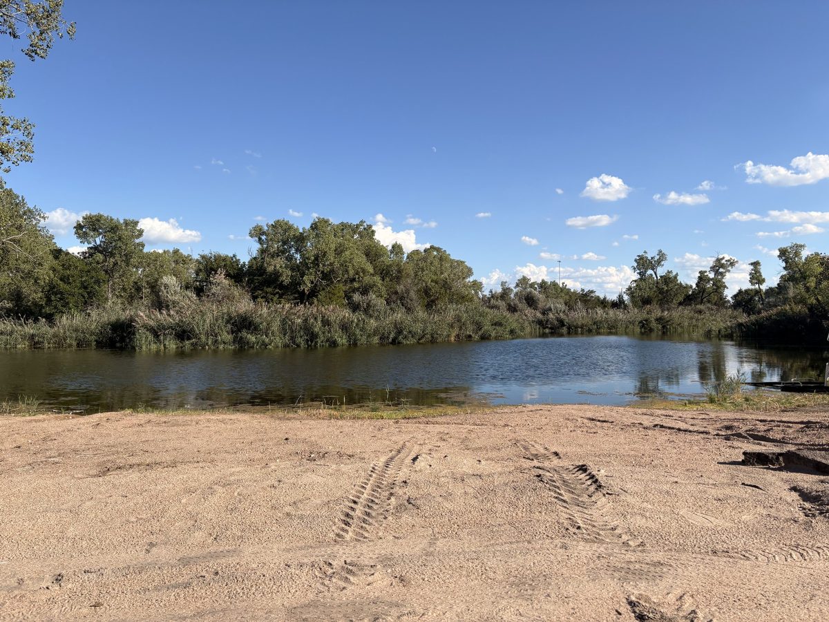 The sandy beach and stocked pond at Lincoln Highway RV Park